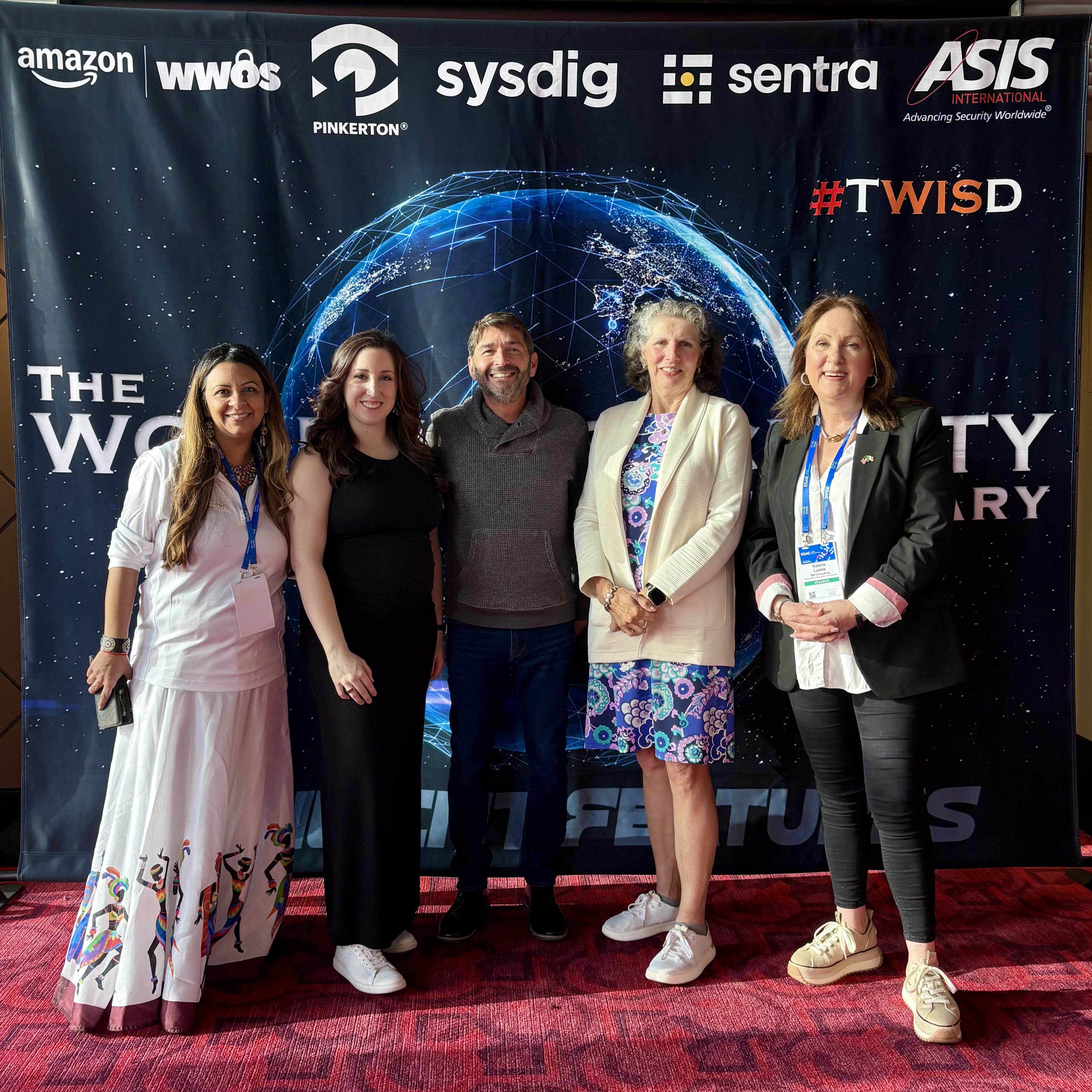 Aarti Gadhia, Stacey Champagne, Richard Ticho, Marene Allison and Dr. Valerie Lyons in front of the backdrop